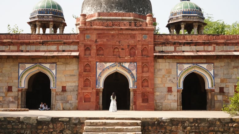 A woman visits the grounds of the 16th century Mughal Emperor Humayun's tomb in New Delhi on October 9, 2023. 